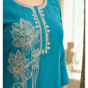 Detail of floral gold sequins and embroidery on teal Roman Silk Suit Gold Handwork kurta.